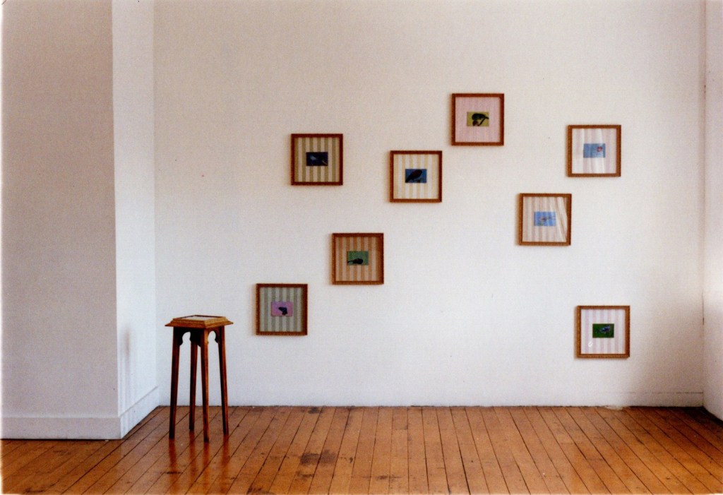 Artwork by Kane Dyer, Dislocated, 1997.  Photograph of a 9 piece painting installation at the Jonathan Smart Gallery, Christchurch, New Zealand. This artwork was a finalist in the Visa Gold Art Awards in 1997